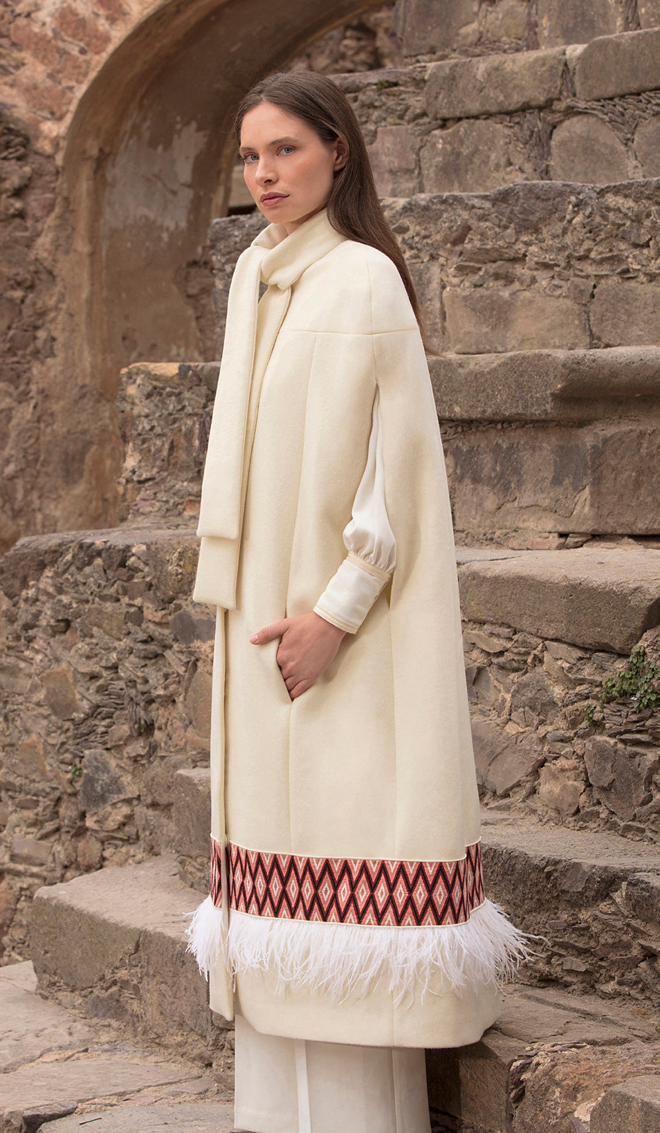 Elegant white coat with intricate stitched piece