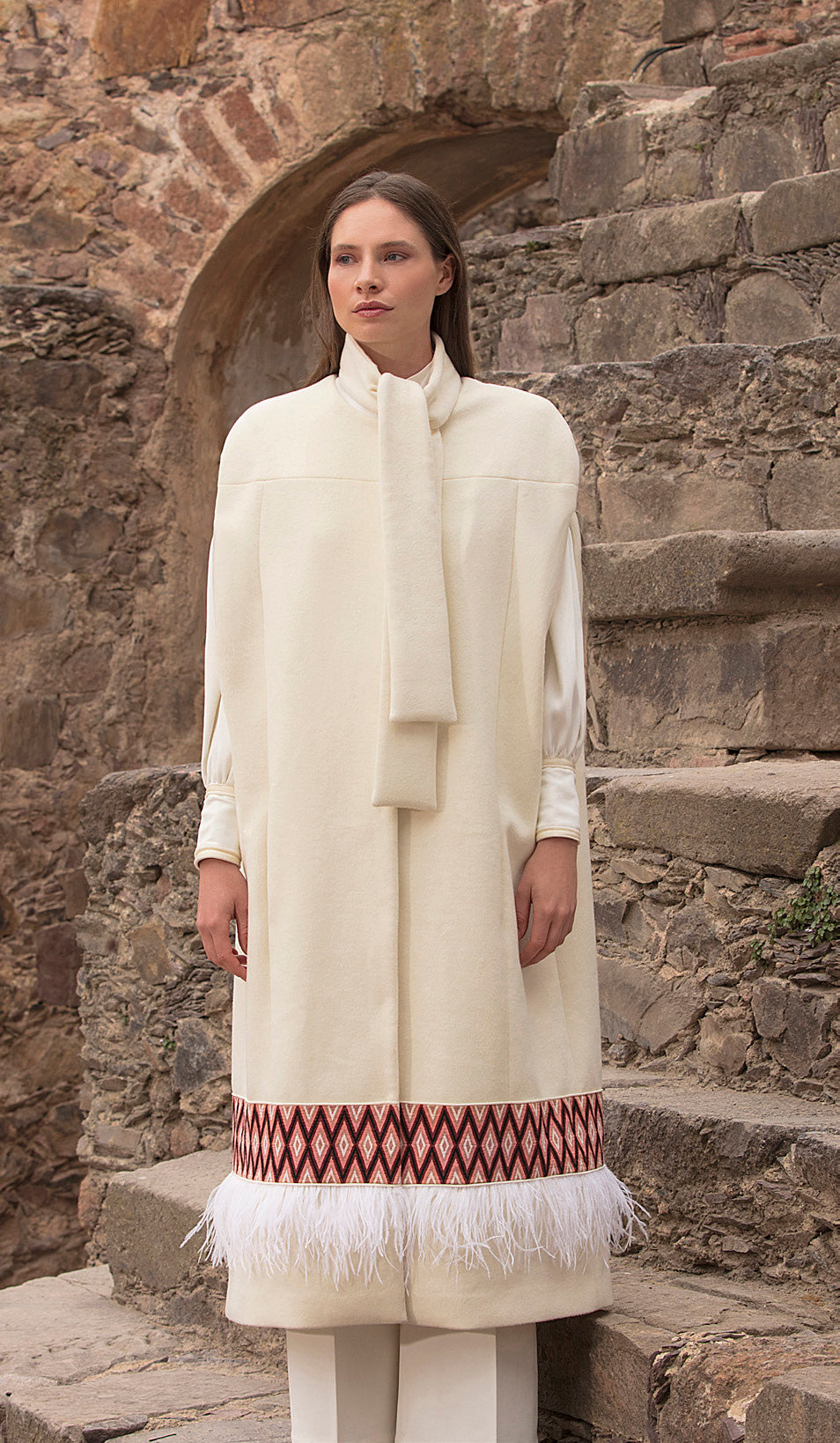 Elegant white coat with intricate stitched piece